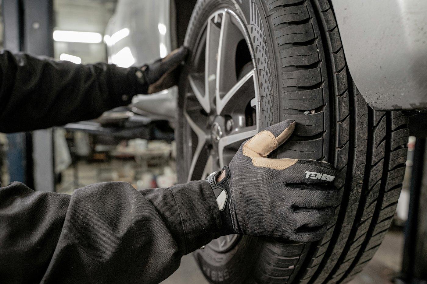 Technician checking a tyre